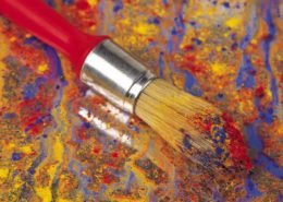 Paint Brush with color applied to canvas