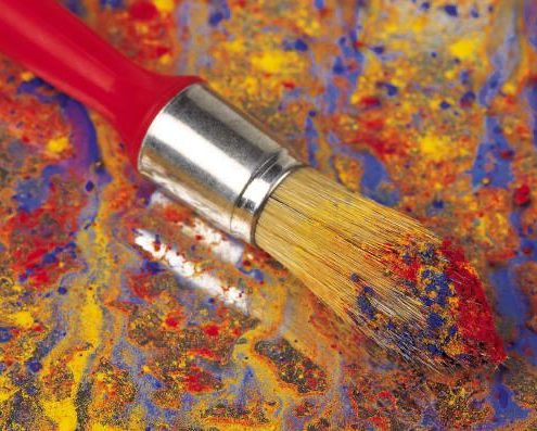 Paint Brush with color applied to canvas