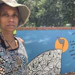 Alexis Stix Brown with mural I Feel Safe--150x150